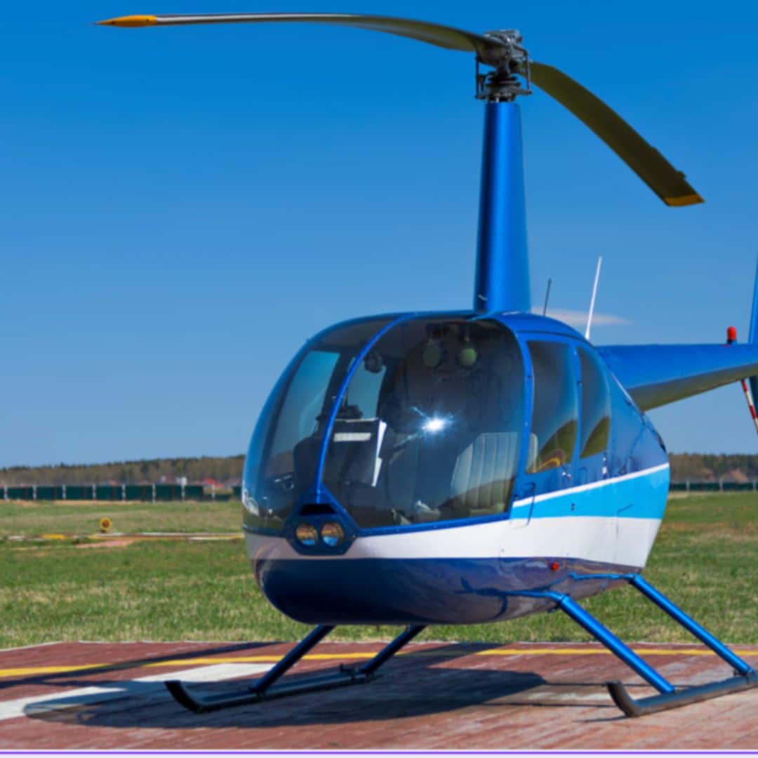 Blue Color Helicopter standing at helipad