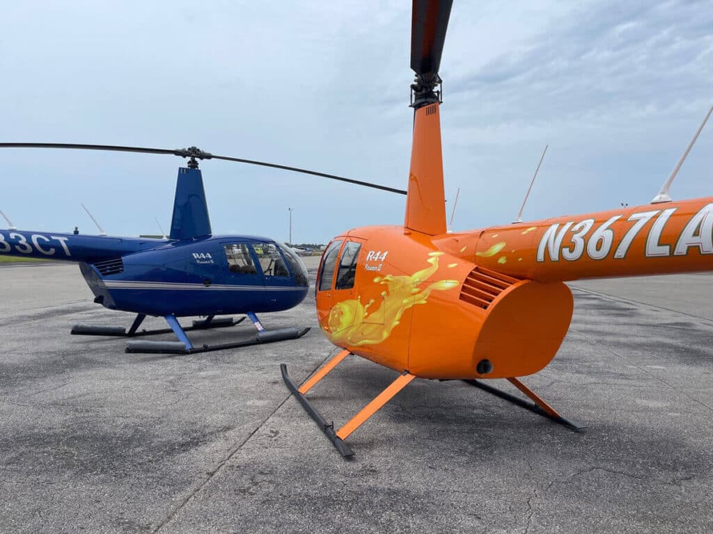 Both R44 Robinson Helicopter standing at the track