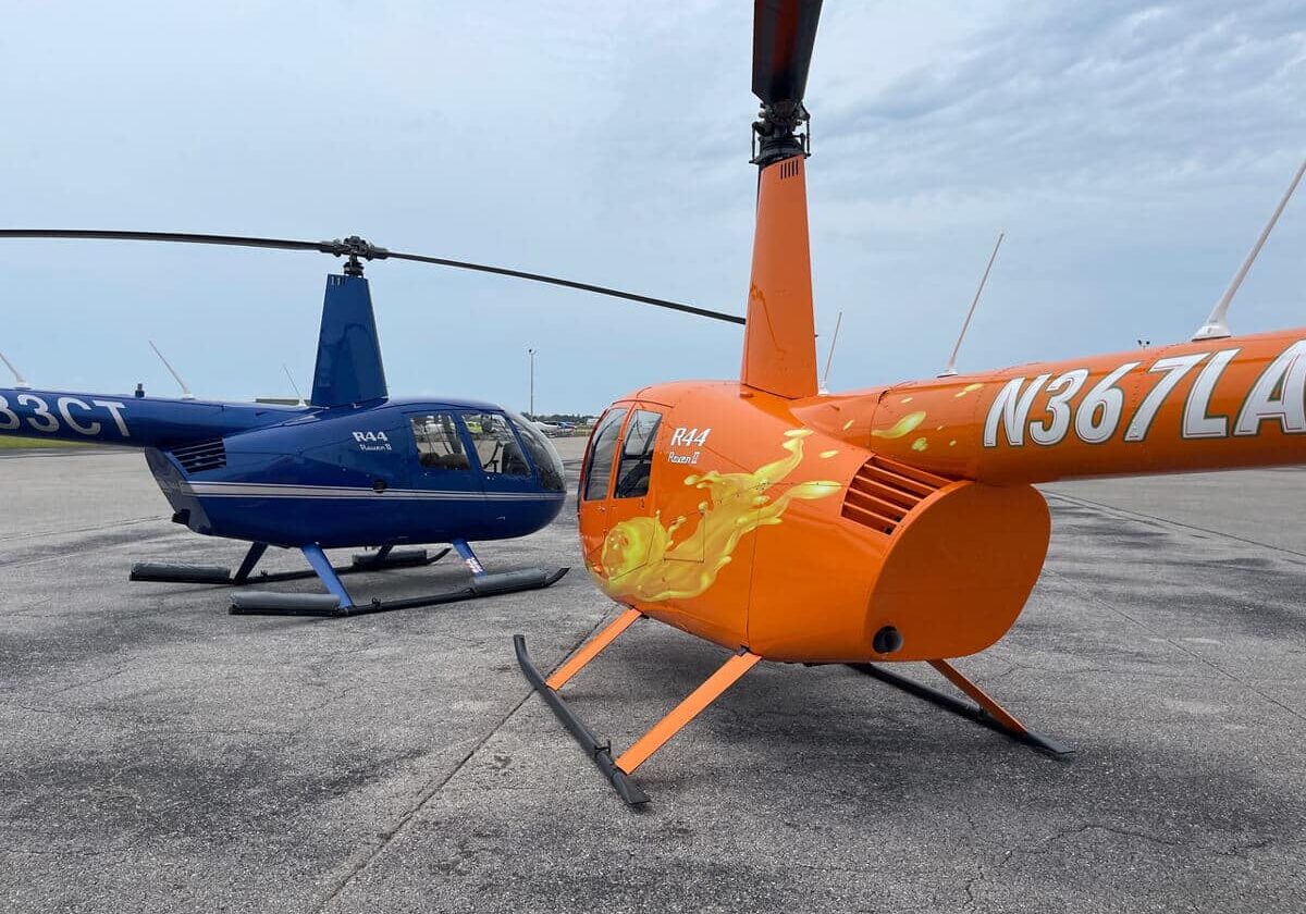 Orange & blue robinson helicopter standing